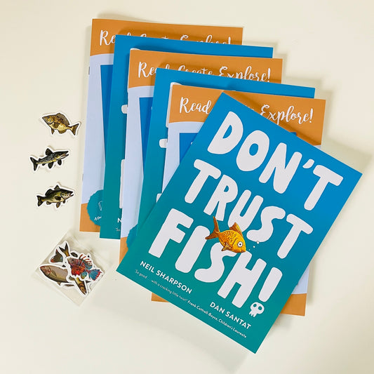 Kids monthly book subscription with 'Don't Trust Fish!' by Neil Sharpson. Books and stickers on a light background.