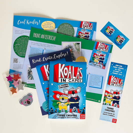 Kids monthly book subscription. Educational materials and book with Koalas In Capes by Terrie Chilvers on a white background.