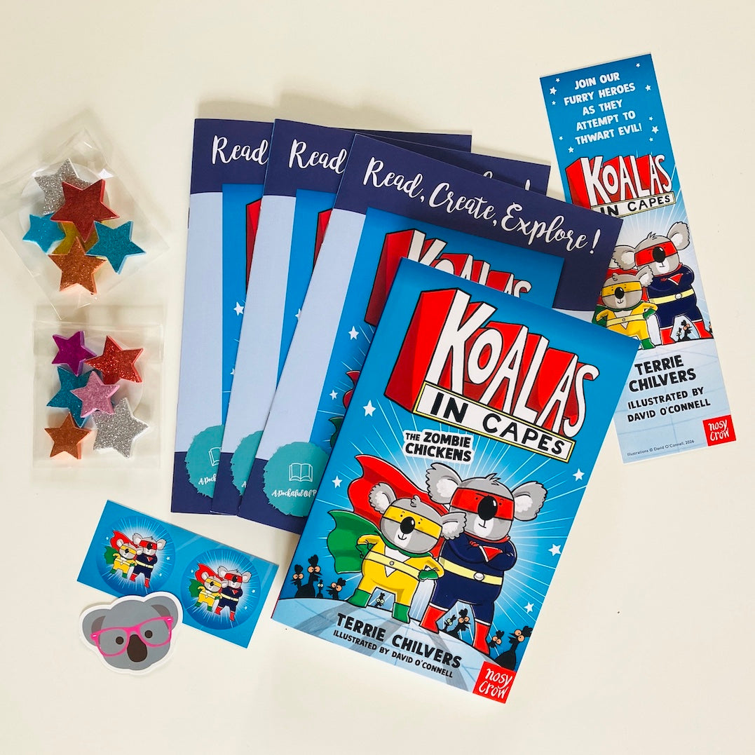 Kids monthly book subscription. Educational materials and book with Koalas In Capes by Terrie Chilvers on a white background.